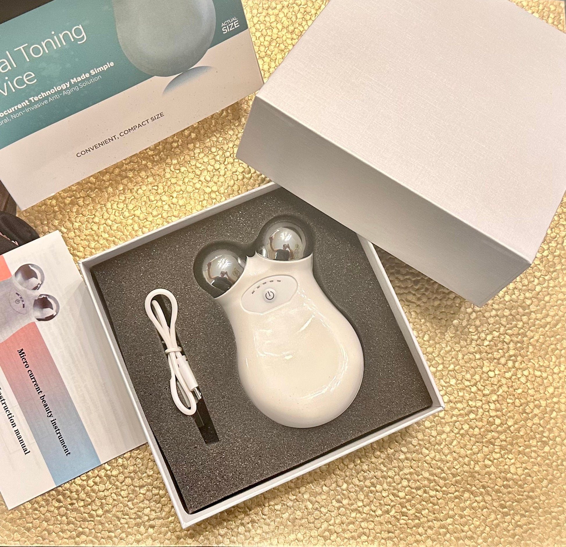 What's in the box: the device, a USB charging cable and the instruction manual