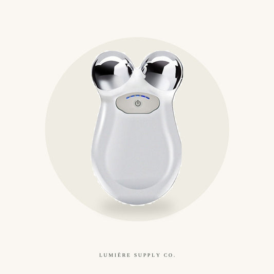 Lumière Lift microcurrent toning device on a cream background